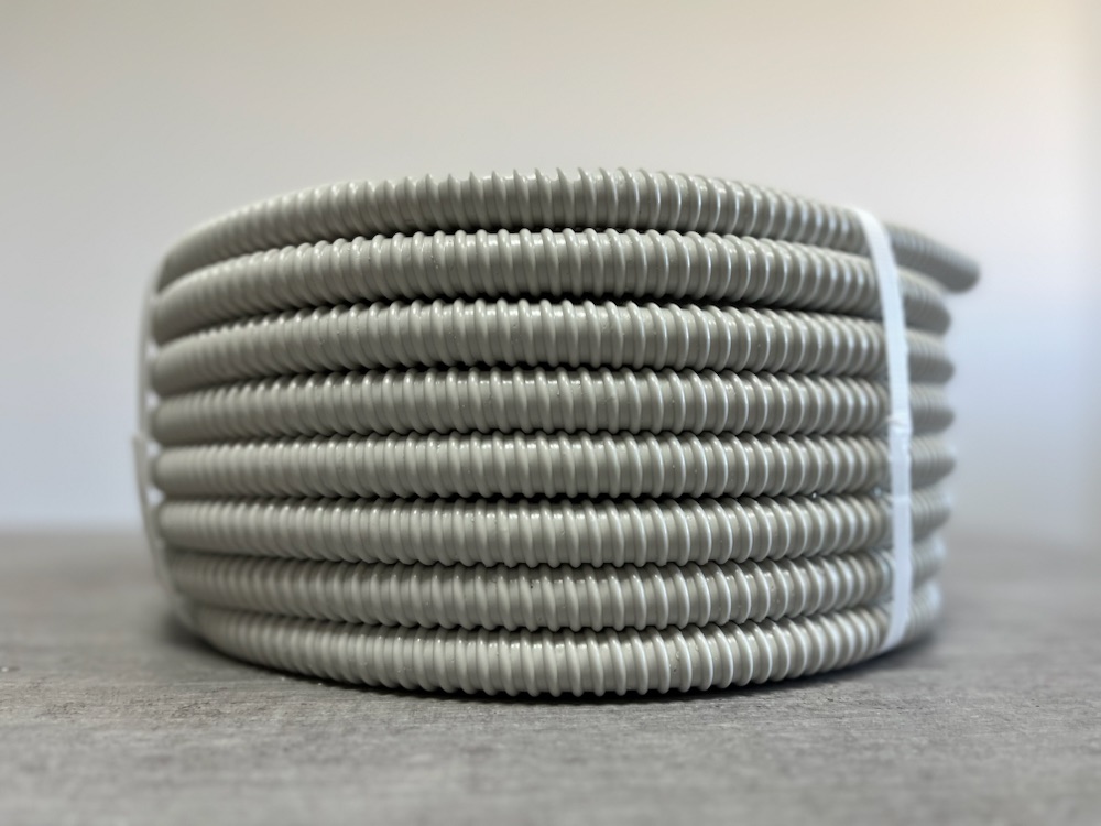 Grey spiral PVC hose coil, side view